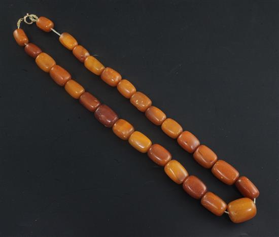 A single strand amber bead necklace, 22in.